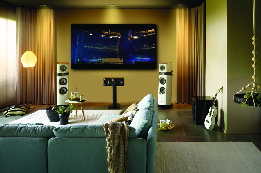 Living room setup with a large TV and high-end audio speakers. 