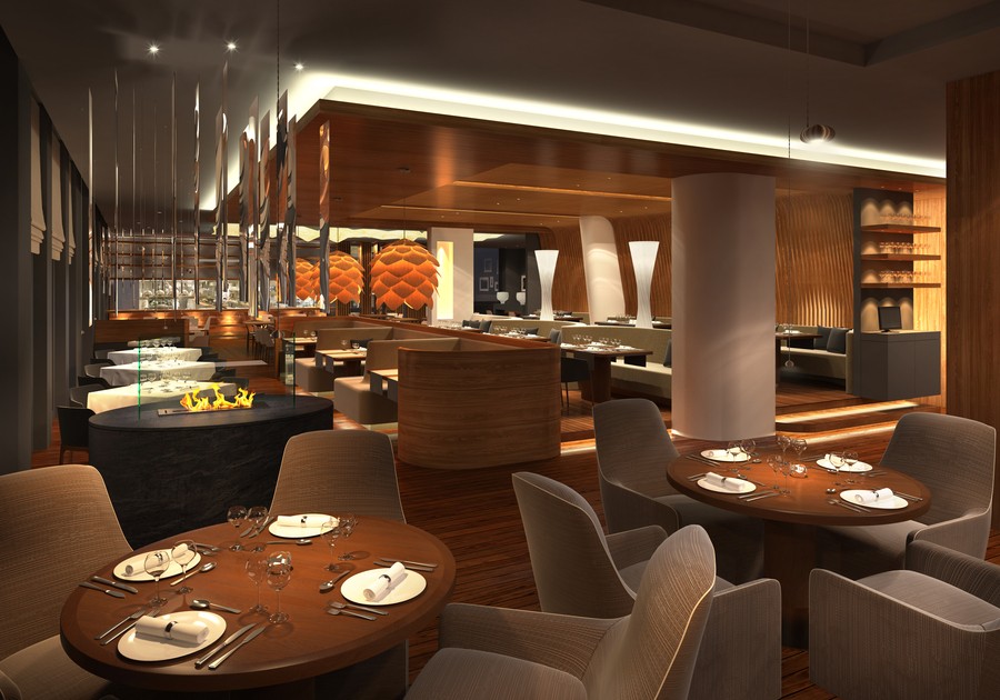 An upscale restaurant illuminated by a layered commercial lighting design.